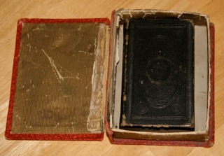 Picture of box with cover open revealing bible